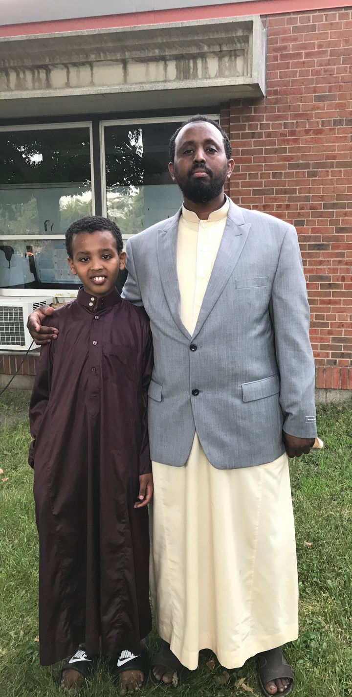 Muhamed Omar and his son. 