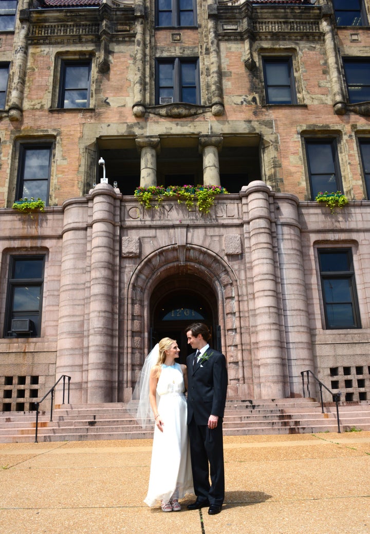 The couple standing outside St. Louis City Hall on their wedding day. 