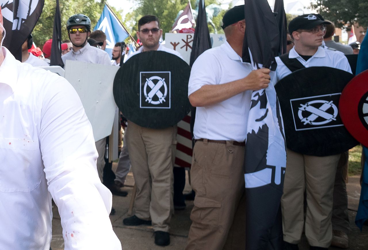 James Alex Fields Jr. (second from left, with a shield) stands at the rally in Charlottesville.