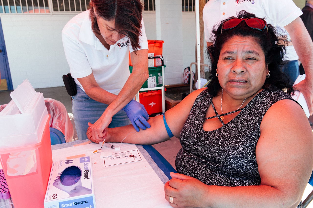 The Center of Excellence for Chagas Disease collects blood samples at an open-air festival for a community of people from Oaxaca, Mexico. The samples will be tested for Chagas disease. Most of the people who gave samples seemed not to have heard of Chagas before, despite coming from an area that puts them at high risk for the disease.