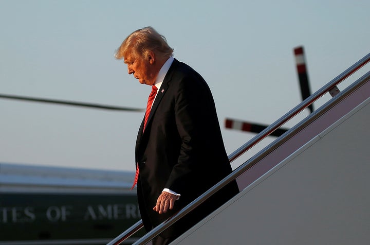 President Donald Trump walks off Air Force One at Joint Base Andrews in Maryland on Aug. 23, 2017.