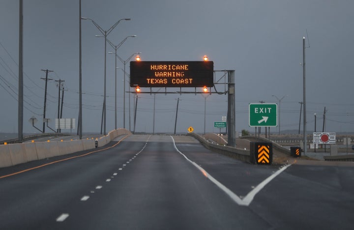 A road sign warns travelers of Hurricane Harvey on Friday in Corpus Christi, Texas.