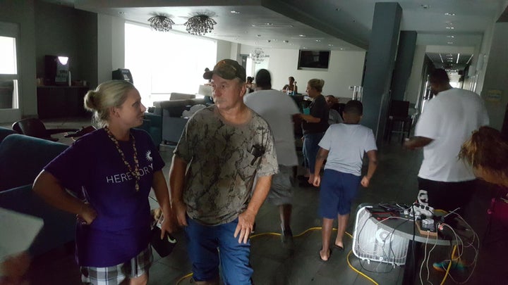 People wait out Hurricane Harvey inside a La Quinta Inn in Victoria. 