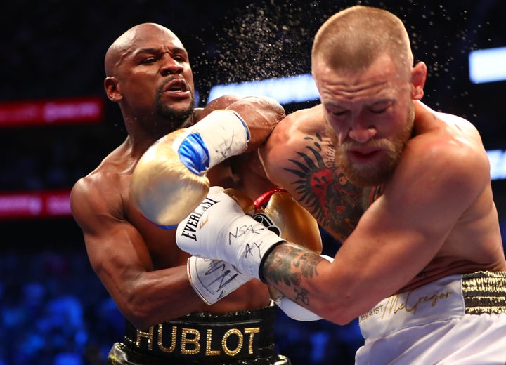 Floyd Mayweather Jr. lands a punch against Conor McGregor during their boxing match at the T-Mobile Arena in Las Vegas on Aug. 26, 2017. Referee Robert Byrd stopped the fight in the 10th round.