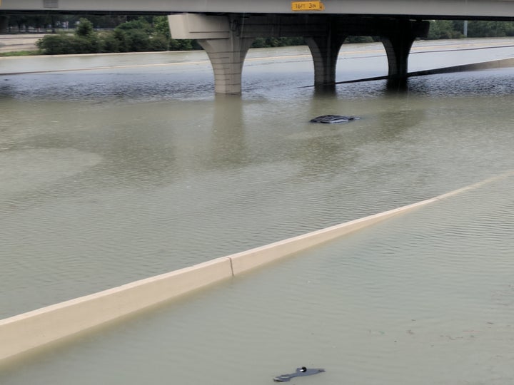 A submerged car in Katy, Texas, during the storm. Authorities are urging people to stay off the roads.