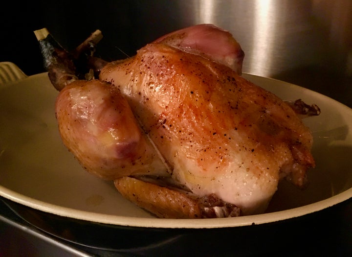 Pot-roasted chicken resting while the sauce is adjusted and strained