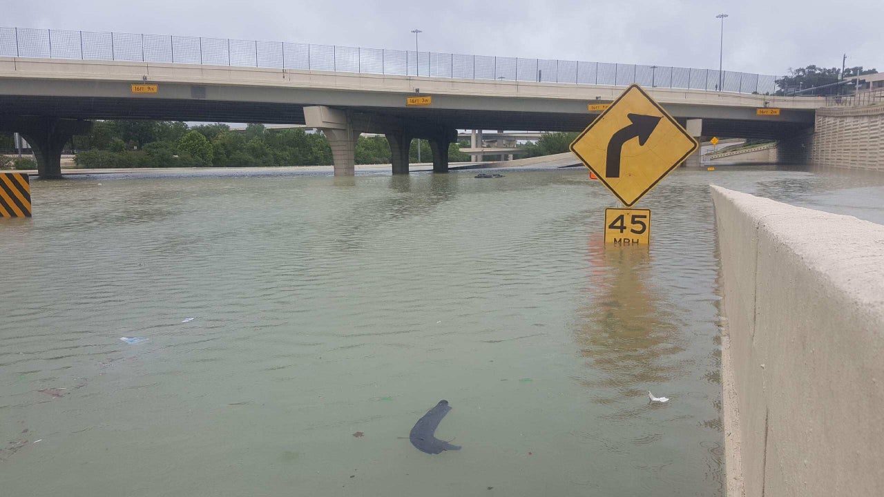 A partially submerged highway sign in Houston.