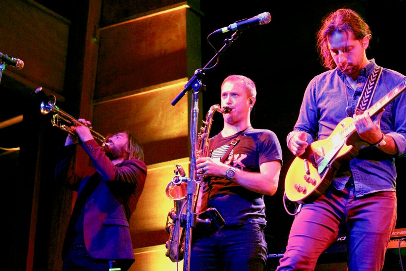 The Revivalists’ Michael Girardot (trumpet), Rob Ingraham (saxophone) and Zack Feinberg (guitar) perform on Aug. 19 at the Fo
