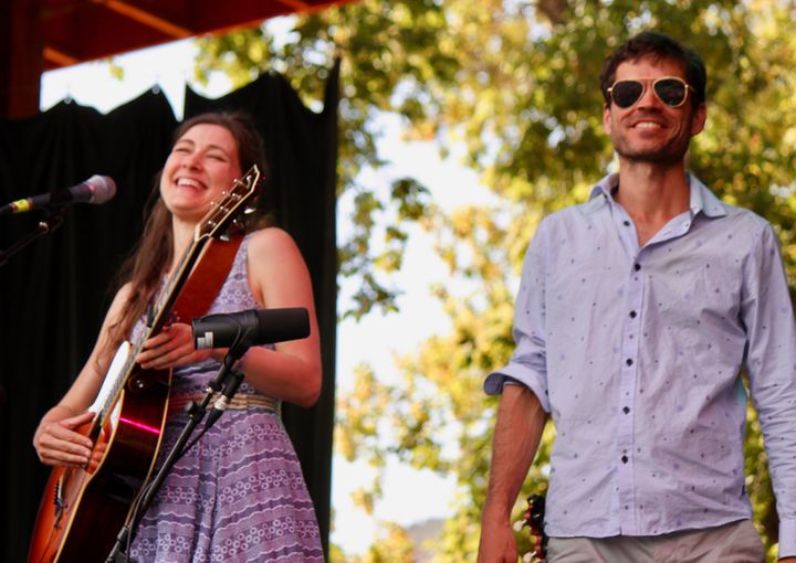 The Wailin’ Jennys’ Ruth Moody (left) and her brother Richard Moody have a laugh on Aug. 20 at the Folks Festival. 