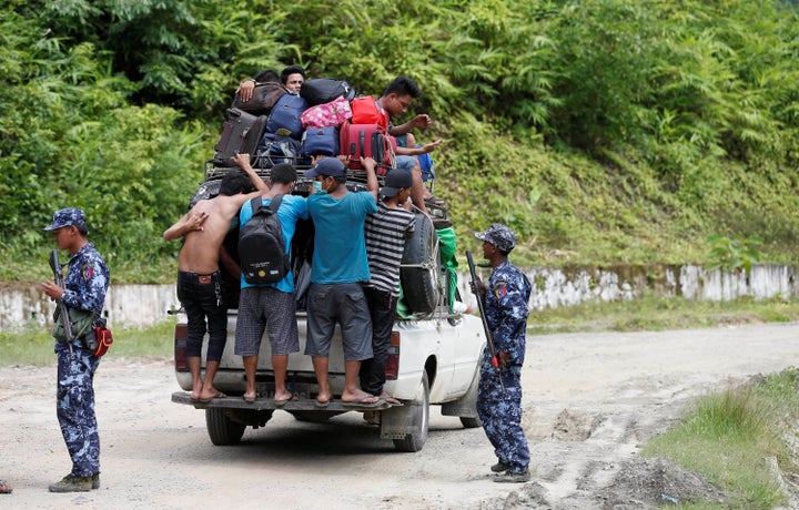 Ethnic Rakhine people who fled from Maungdaw after Arakan Rohingya Salvation Army (ARSA) had attacked, arrive in Buthidaung,