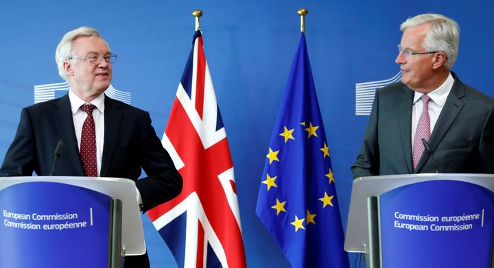 Britain's Secretary of State for Exiting the European Union David Davis and European Union's chief Brexit negotiator Michel Barnier talk to the media ahead of Brexit talks in Brussels.