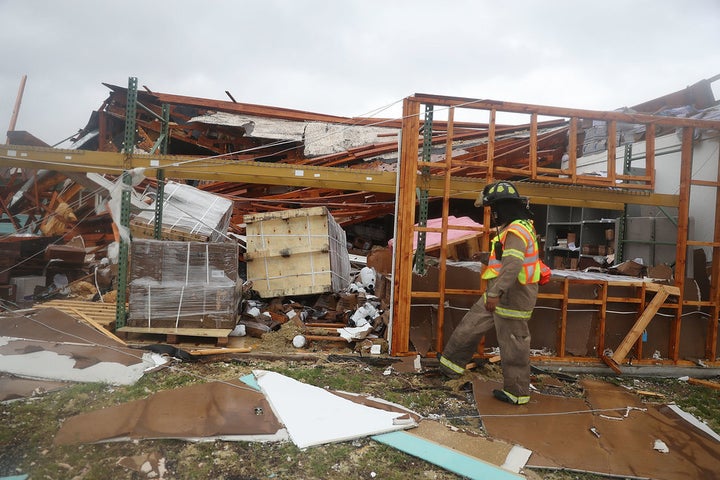 Firefighter checks homes for people in Rockport, TX after Hurricane Harvey