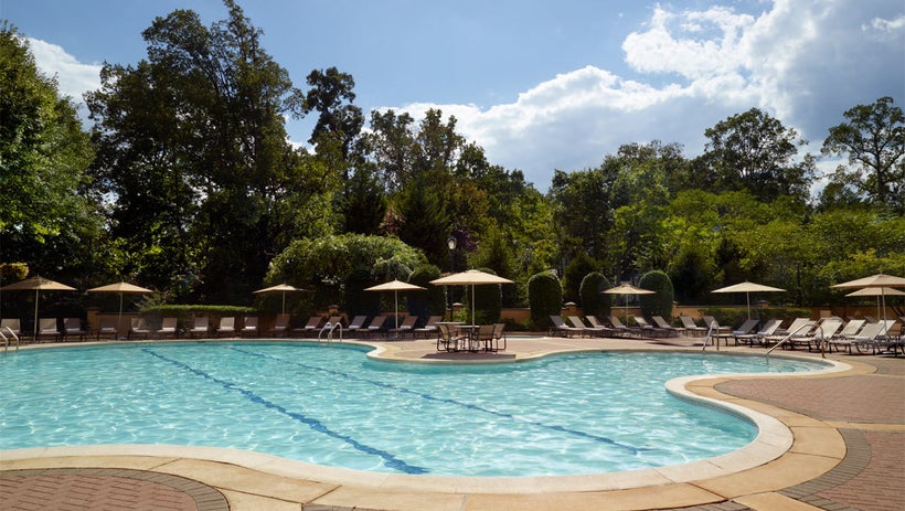 The resort-style pool area includes plenty of chairs for large parties to lounge together, a splash pool for kiddos and a hot