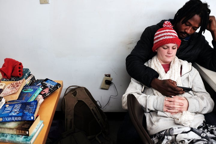 A homeless couple rests at the Seashore Mission in Biloxi, Mississippi, on Jan. 3, 2016. Biloxi continues to strugg