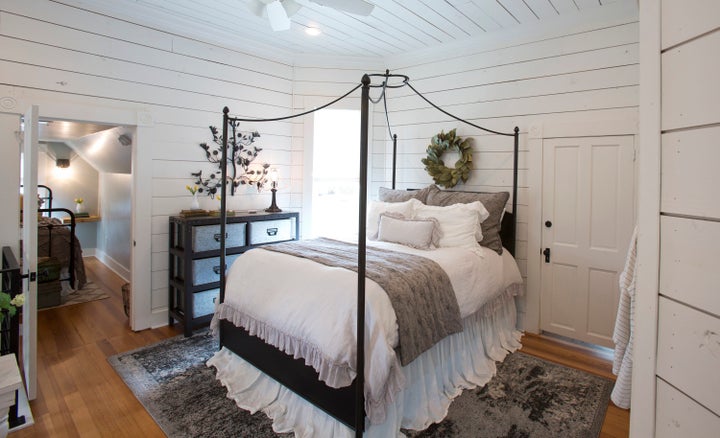 An upstairs landing area made into a bedroom suite.