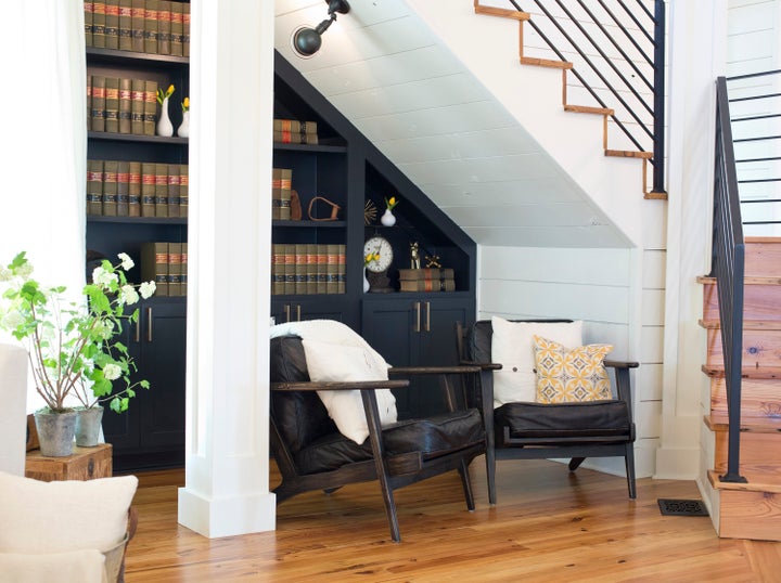 A reading nook beneath the stairs on the first fl