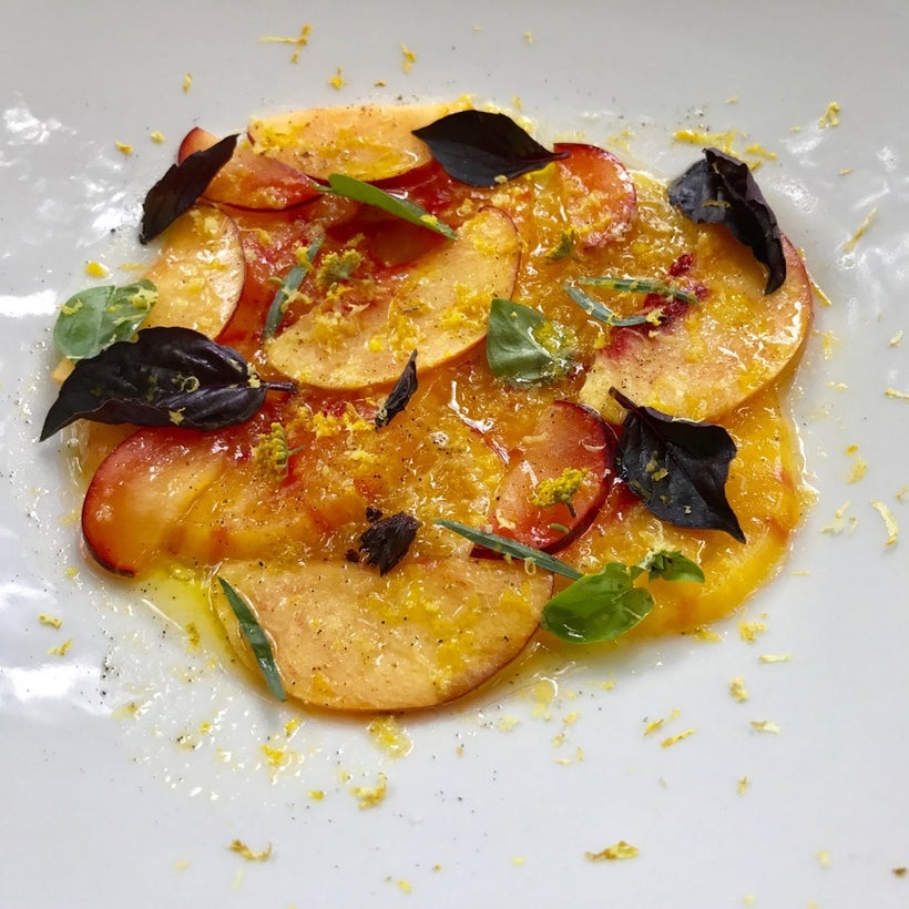 Peach and tomato salad as prepared by Cacinda Maloney of <a rel="nofollow" href="https://www.pointsandtravel.com/" target="_b