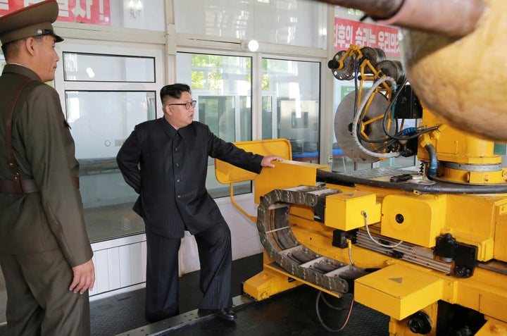 North Korean leader Kim Jong-Un looks on during a visit to the Chemical Material Institute of the Academy of Defense Science