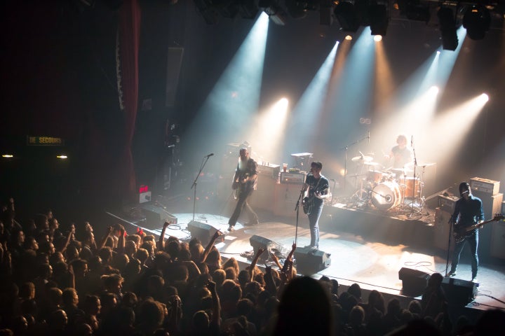 American rock group Eagles of Death Metal perform on stage on November 13, 2015 at the Bataclan concert hall in Paris, a few