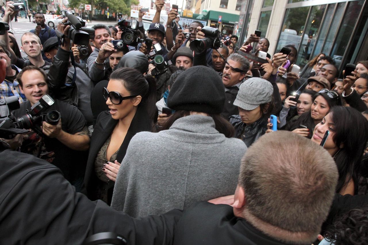 Kim Kardashian leaving her hotel causing a chaotic crowd of fans and paparazzi in 2010.