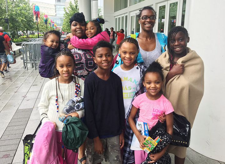 Nina Robinson, top right, lost her home and brought six kids to the shelter at George R. Brown Convention Center in Houston.