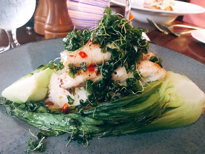 <p>Cobalt Restaurant’s Red Snapper with jasmine rice and baby bok choy</p>