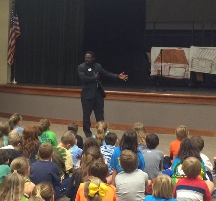 Charles Woods teaching young students about the civil rights movement