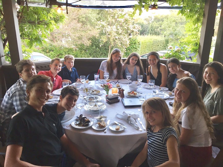 Keswin kids with new friends (note the phones stacked in the middle of the table).