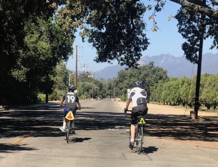 <p>My son and husband, riding and connecting. No hands available to check phones!</p>