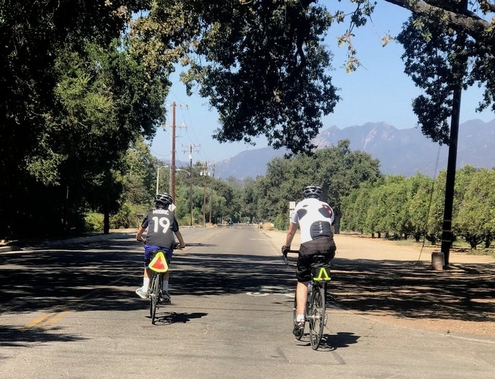 My son and husband, riding and connecting. No hands available to check phones!