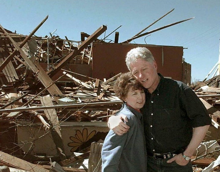 Bill Clinton surveying damage from a series of 2004 tornados in Arkadelphia, Arkansas.