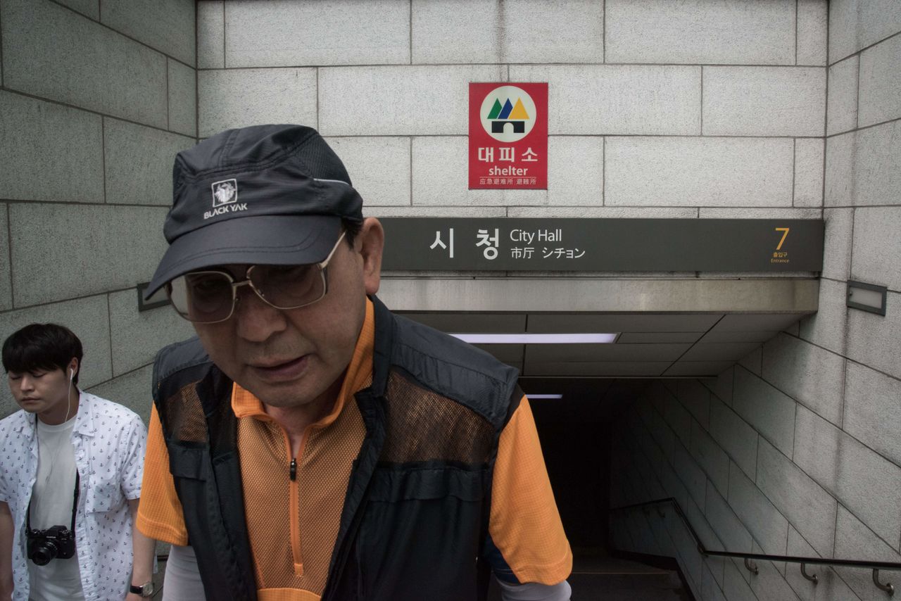 A "shelter" sign hangs at the entrance to a subway station in Seoul on July 5.