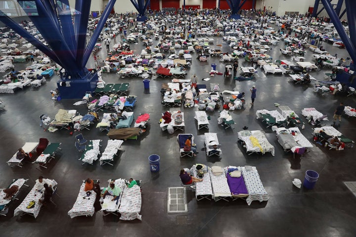 People take shelter at the George R. Brown Convention Center in Houston.