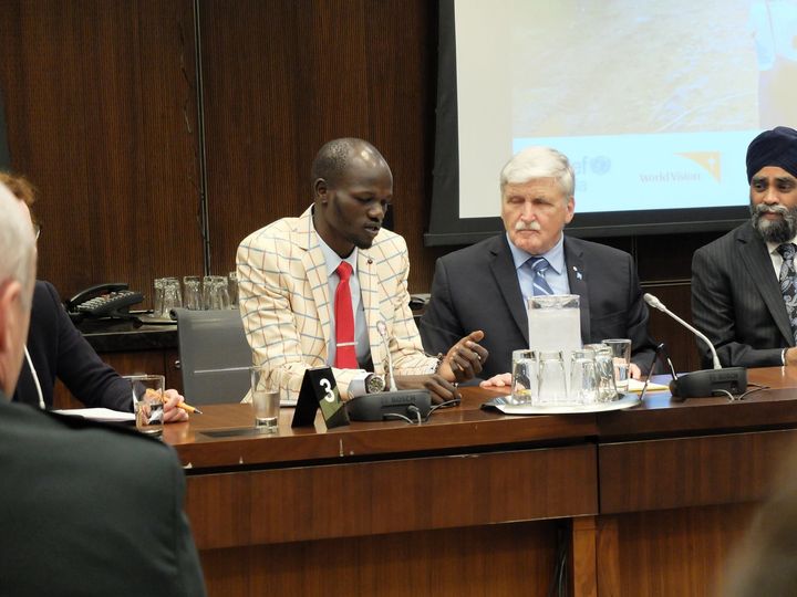 Thuch (far left) with Romeo Dallaire, during the International Day of Peacekeepers