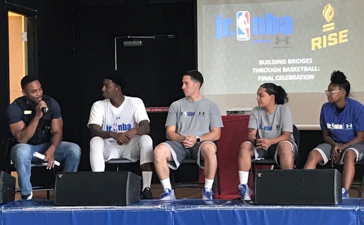 Student-athletes, basketball coaches and a Chicago police officer participate in a panel discussion Thursday, Aug. 24, about the Building Bridges Through Basketball program. 
