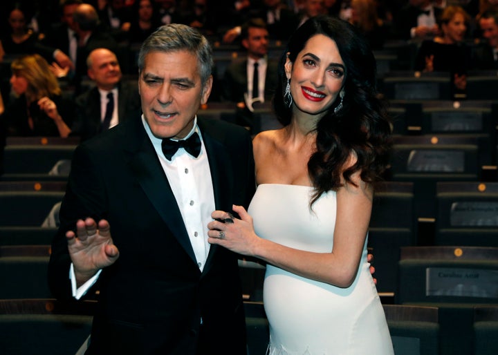 Actor George Clooney, pictured with wife Amal Clooney, the respected international human rights lawyer, took a thinly veiled swipe at the U.S. president while attending the Cesar Awards ceremony in Paris.