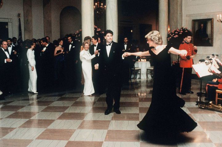 Diana dances with John Travolta at the White House, watched by President Ronald Reagan