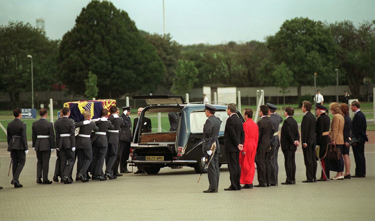 Prince Charles with Lady Sarah Mccorquodale, Lady Jane Fellowes and Prime Minister Tony Blair watching as the coffin of Diana, Princess of Wales, is carried from the airplane to a hearse at Raf Northolt.