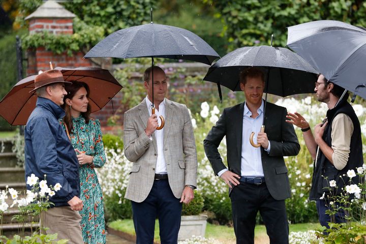 The Duke and Duchess of Cambridge and Prince Harry visit the White Garden in Kensington Palace.