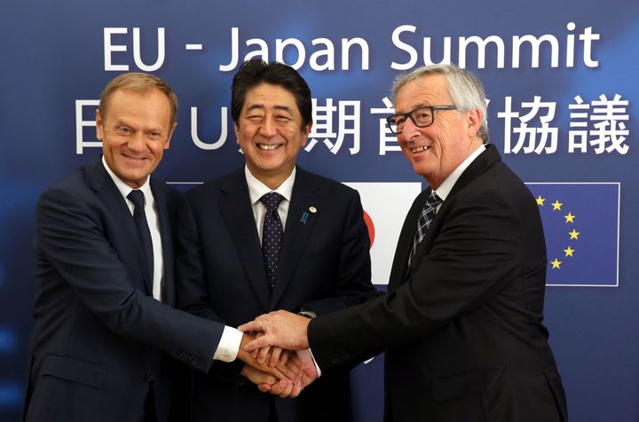 European Council President Donald Tusk (L), Japanese Prime Minister Shinzo Abe (C) and President of Commission Jean-Claude Juncker at the European Council on July 6, 2017 after agreeing the broad outline of a landmark trade deal.