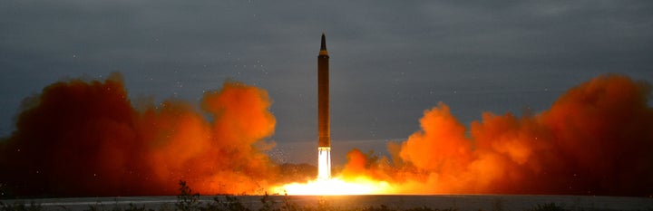 A missile is launched during a long and medium-range ballistic rocket launch drill in this undated photo released by North Ko