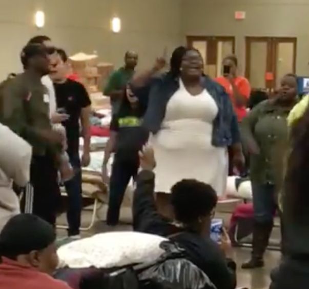 A woman breaks into gospel at a shelter for Hurricane Harvey victims in Conroe, Texas.