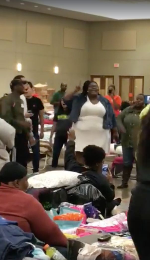 A woman breaks into gospel at a shelter for Hurricane Harvey victims in Conroe, Texas.