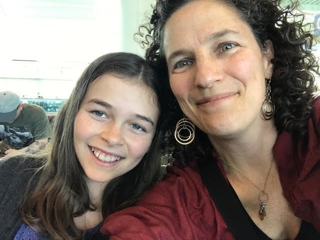 Lisa Frack, president of the board of Oregon NOW, with her 11-year-old daughter Georgia.