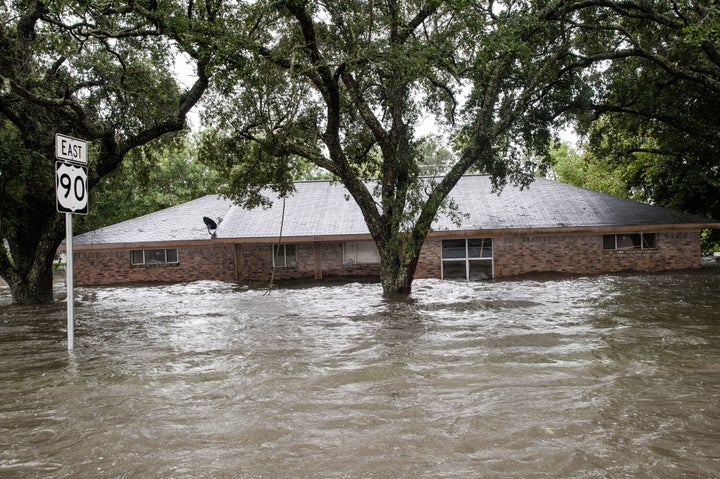 A home is deluged near Nome, Texas.