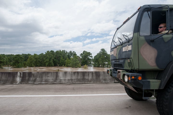 A military vehicle heads toward Port Arthur, on the Gulf Coast near the Louisiana border.