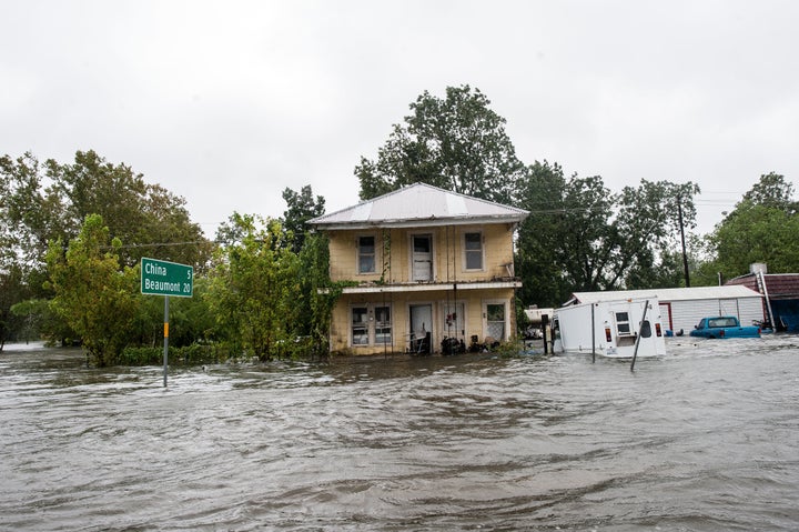 Floodwaters lap at the door of a home in Nome, Texas, a small town about 25 miles west of Beaumont.