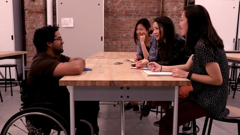 A design team for Open Stye Lab interviewing their client in its fourth year focusing on Spinal Cord Injury.