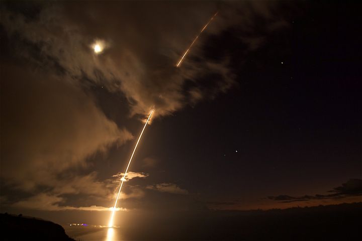 A medium-range ballistic missile target is launched from the Pacific Missile Range Facility, before being successfully intercepted by Standard Missile-6 missiles fired from the guided-missile destroyer USS John Paul Jones, in Kauai, Hawaii