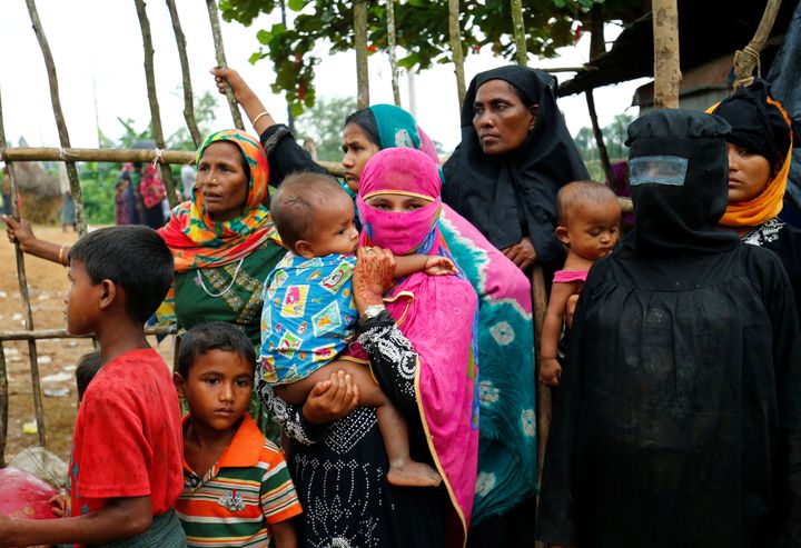 New Rohingya refugees wait to enter the Kutupalang makeshift refugee camp, in Cox’s Bazar, Bangladesh on Wednesday.